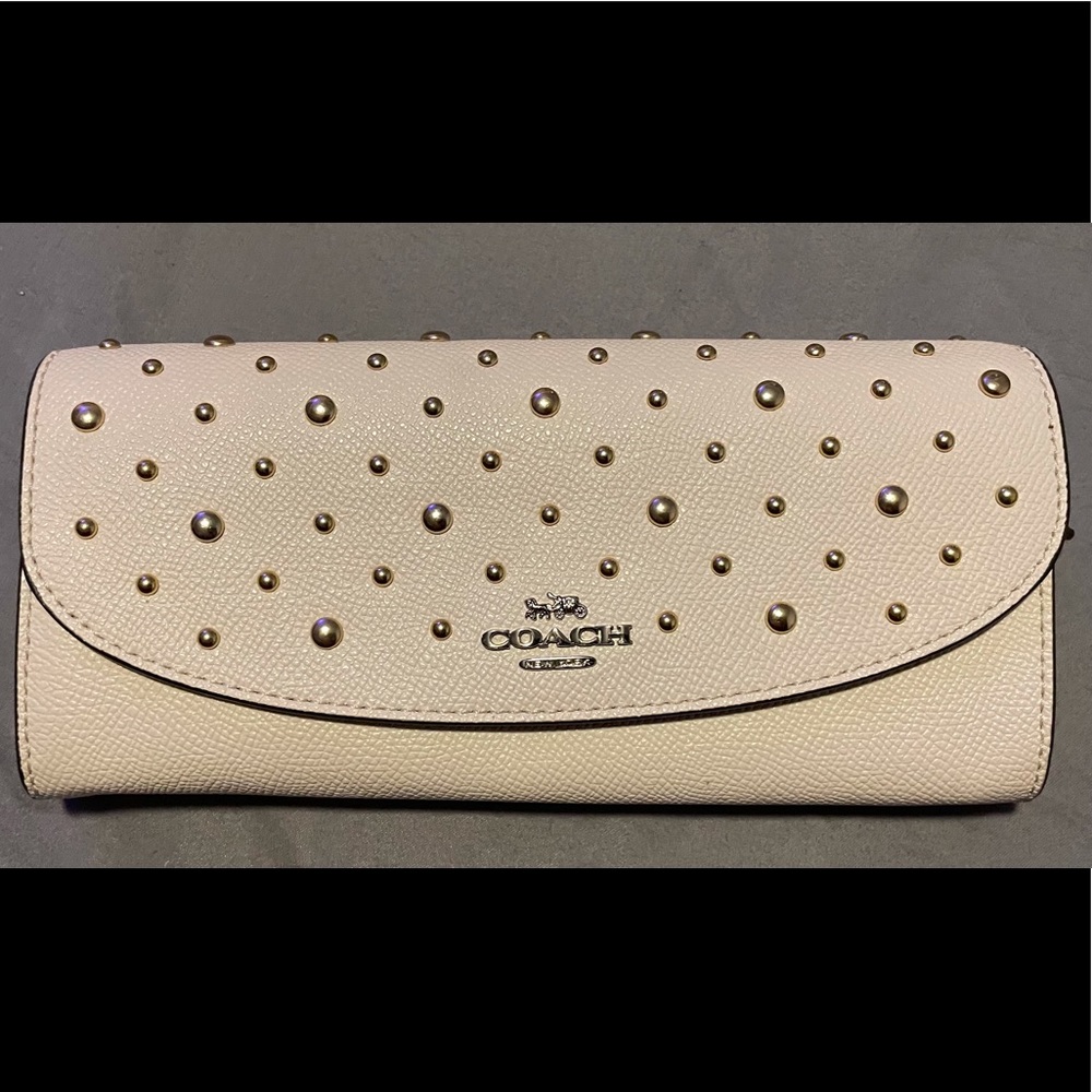 Coach cream/ivory studded flap style wallet
